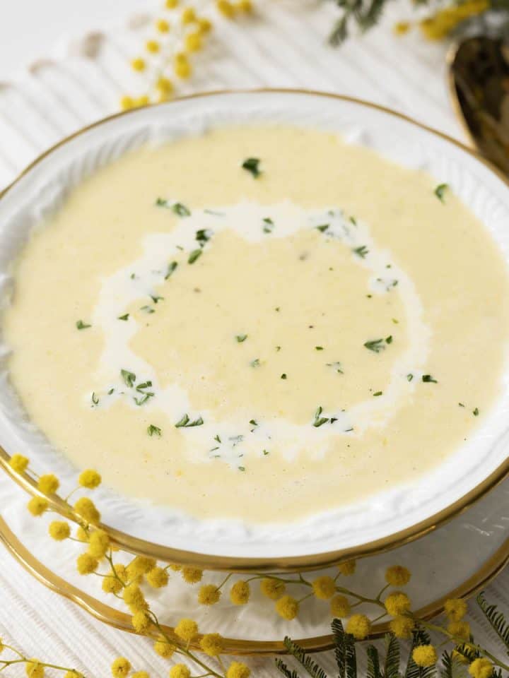A bowl of Japanese corn soup drizzled with cream.